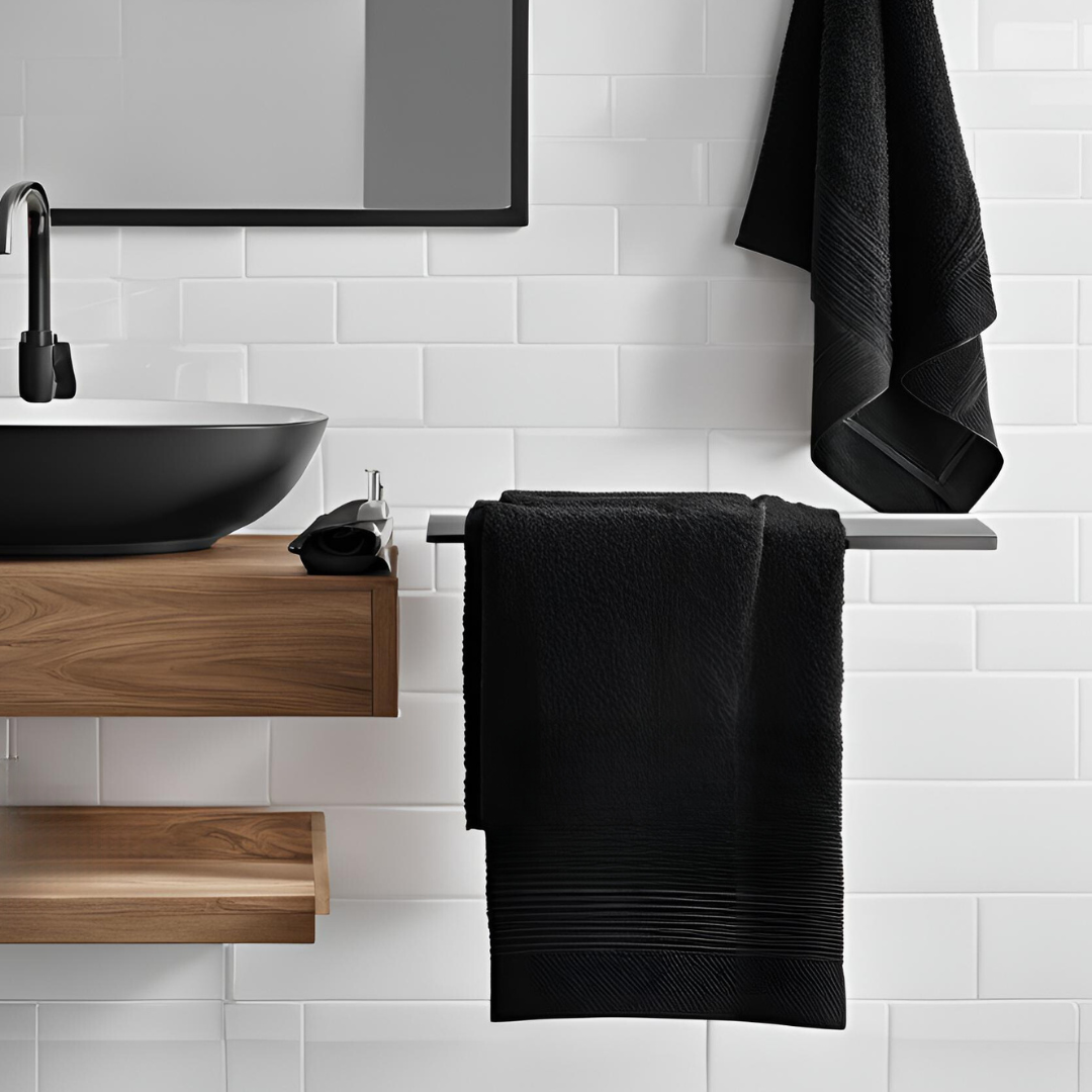 A neatly folded organic cotton towel in a soft, natural shade, with a smooth, plush texture. The towel lies on a wooden surface, radiating a sense of warmth and luxury. Nearby, a hint of greenery adds a touch of nature, highlighting the towel’s eco-friendly, sustainable origins, perfect for a relaxing, spa-like self-care experience
