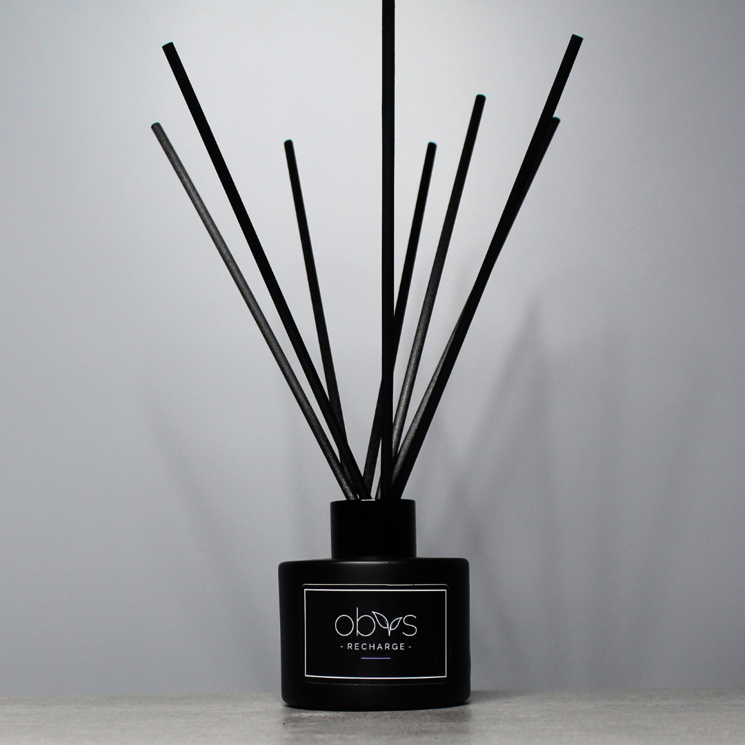 A collection of eco-luxury diffusers with natural reeds and refined, essential oil blends, bringing a subtle, sophisticated scent to any room while enhancing a sustainable, elegant home atmosphere.