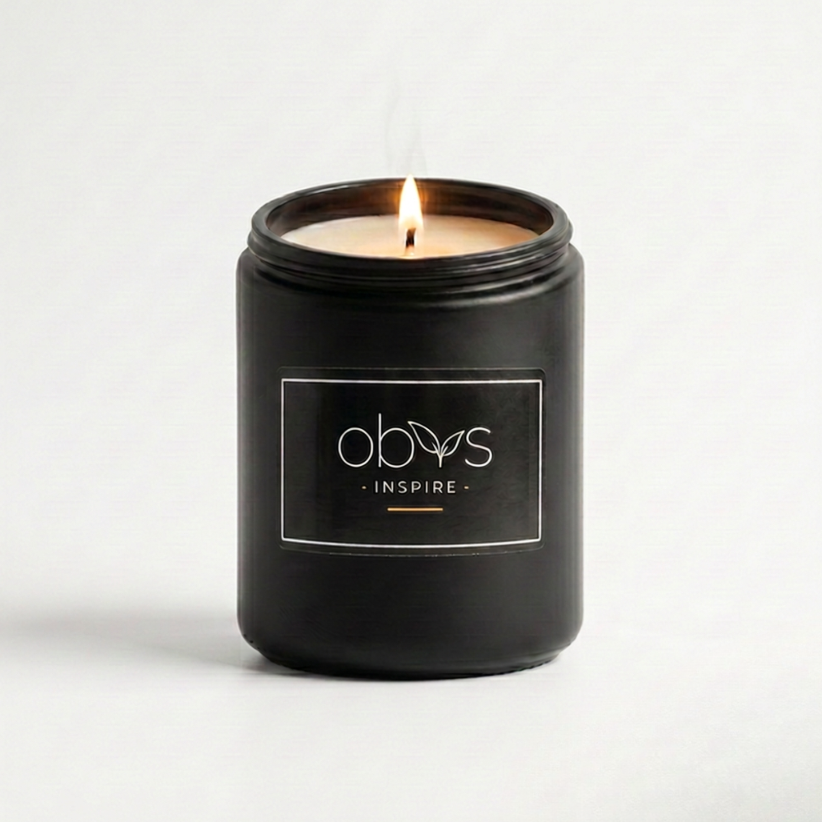 Black candle jar with 'obvs' logo and 'Inspire' text on a white background