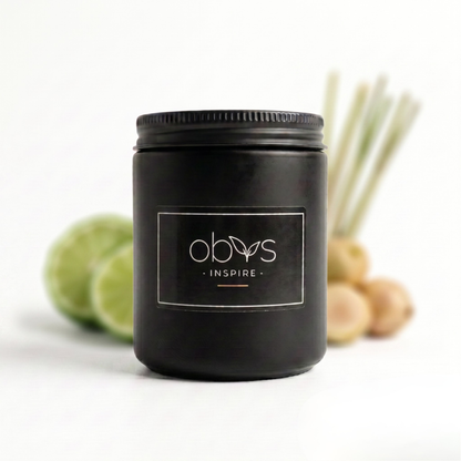 Black candle jar with 'obvs' label on a white background