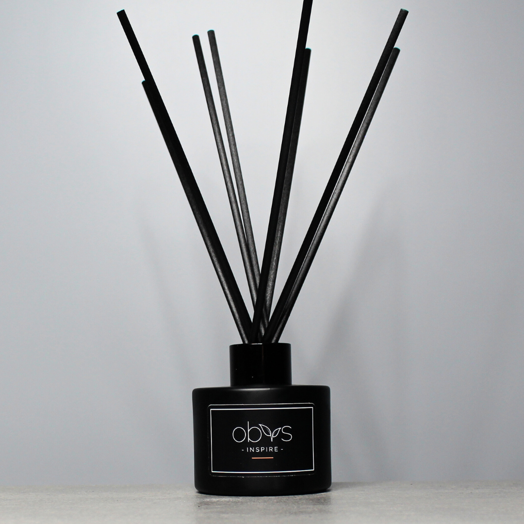 A collection of eco-luxury diffusers with natural reeds and refined, essential oil blends, bringing a subtle, sophisticated scent to any room while enhancing a sustainable, elegant home atmosphere