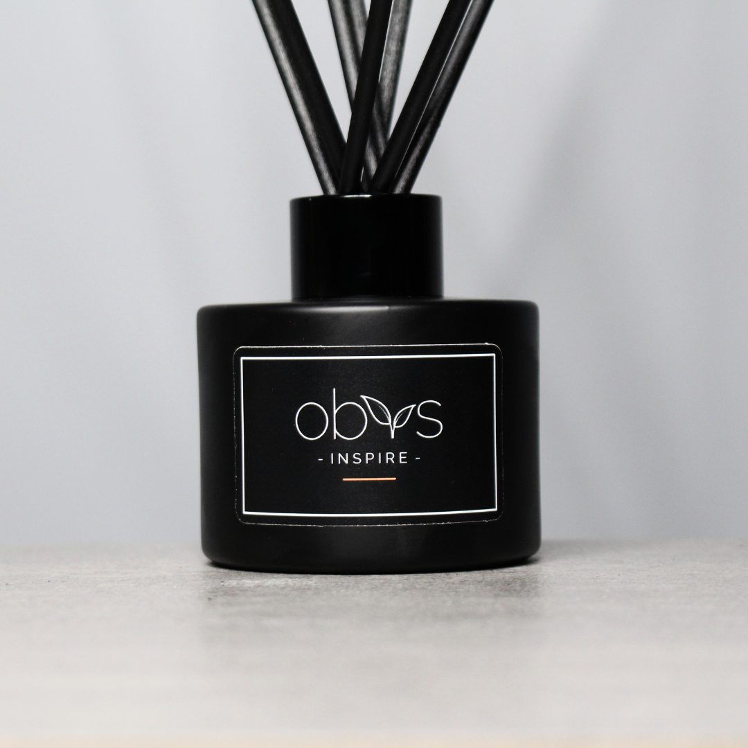 A collection of eco-luxury diffusers with natural reeds and refined, essential oil blends, bringing a subtle, sophisticated scent to any room while enhancing a sustainable, elegant home atmosphere