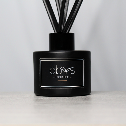 A collection of eco-luxury diffusers with natural reeds and refined, essential oil blends, bringing a subtle, sophisticated scent to any room while enhancing a sustainable, elegant home atmosphere