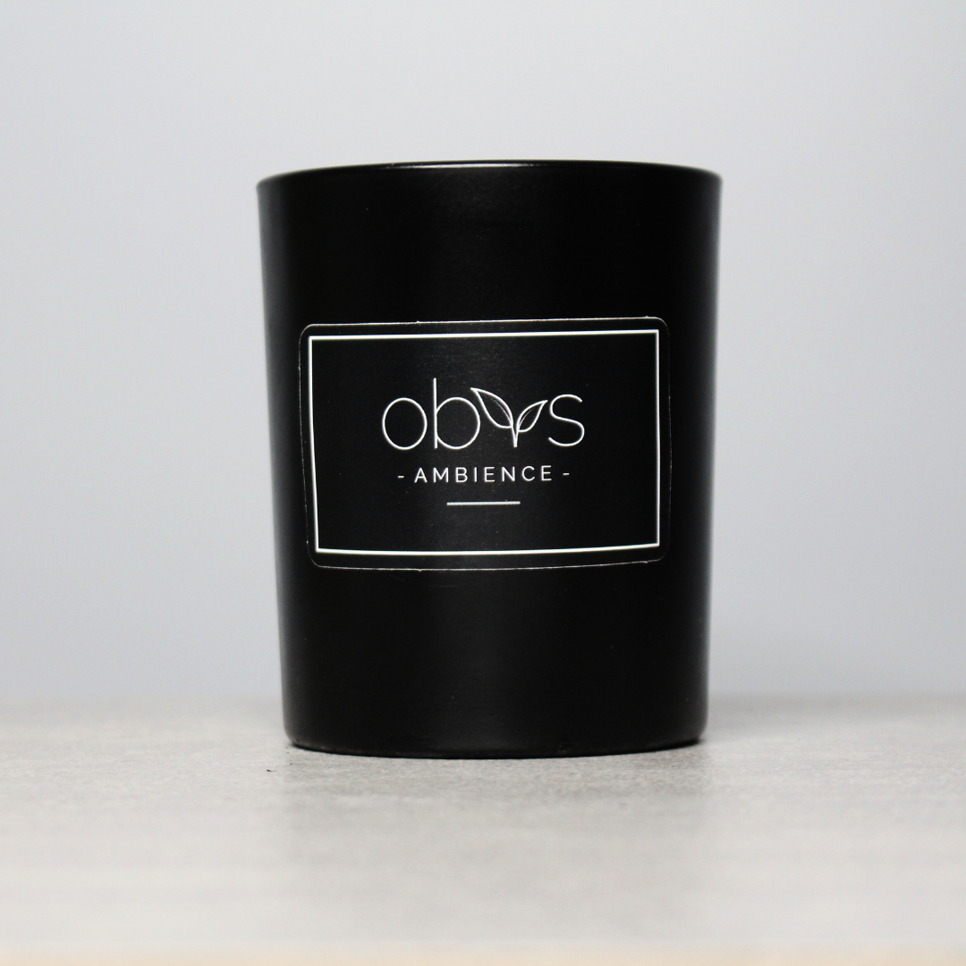 A set of eco-luxury candles with natural wax, elegantly housed in reusable containers, creating a warm, inviting ambiance. Perfect for a sustainable, high-end home aesthetic.