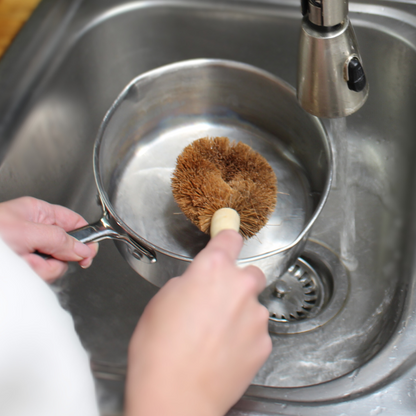 Meet the eco-friendly Pot &amp; Pan Brush, crafted with durable, natural coconut fibres and a sturdy wooden handle for an effective, non-scratch clean. Measuring 21cm by 7.5cm, this thoughtfully designed brush is gentle on cookware but tough on grime, making it the perfect sustainable choice for everyday cleaning.